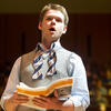 A music student singing on stage.