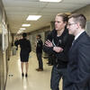 Two pharmacy students discussing a research poster on Research Day