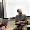 A teacher consults a group of students regarding a difficult proof.